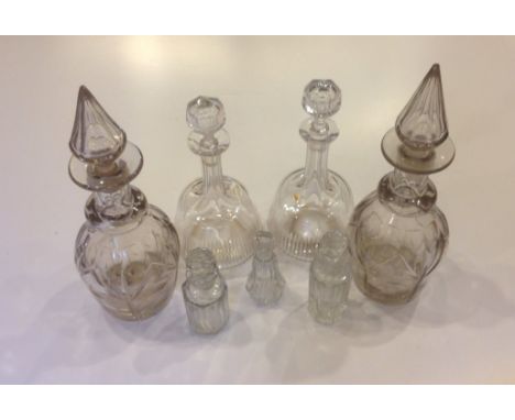 A PAIR OF GEORGIAN RING NECK DECANTERS Along with a pair of Edwardian decanters and three smaller bottle decanters. 