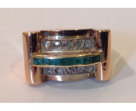 A MID 20TH CENTURY YELLOW METAL, DIAMOND AND EMERALD COCKTAIL RING Size N.  (527)