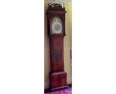 JOHN SIMCOCK, ACTIVE 1719 - 1727, A GEORGE I PERIOD WALNUT LONGCASE CLOCK With a swan necked pediment above a brass and silve