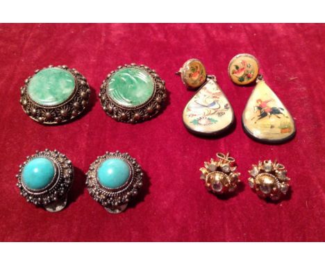 FOUR PAIRS OF EARRINGS To include a pair of silver gilt and crystal studs, a pair of filigree clip-on earrings, with jade cra