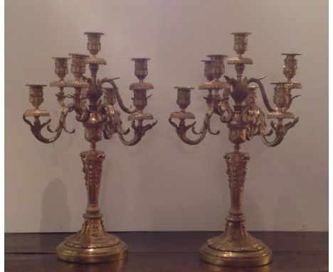 A PAIR OF REGENCY DESIGN GILT BRONZE SEVEN BRANCH CANDELABRAS. (61cm tall)  Condition: good