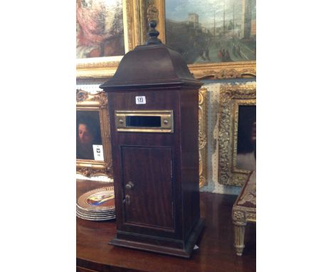 A MAHOGANY TABLE TOP POSTBOX  With caddy top, having brass fittings and bearing label for Farrow & Jackson, London. (71cm x 2