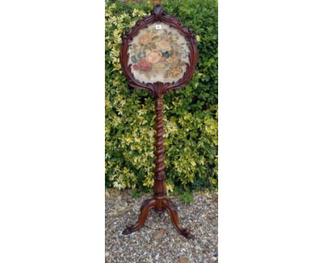 A 19TH CENTURY ROSEWOOD TELESCOPIC POLE SCREEN Having carved floral decoration and inset floral tapestry, supported on a barl