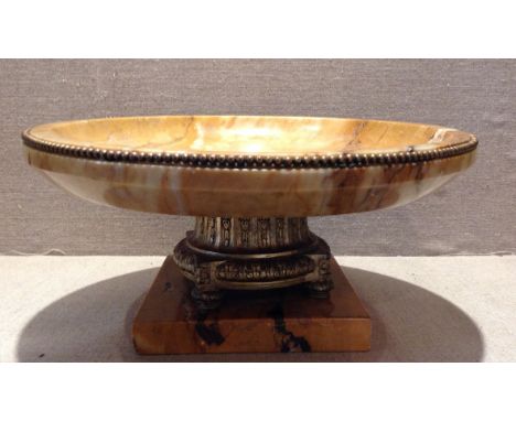 A 19TH CENTURY MARBLE TAZZA Cast with a classical floral decoration and having a bronze ormolu beaded rim and central pedesta