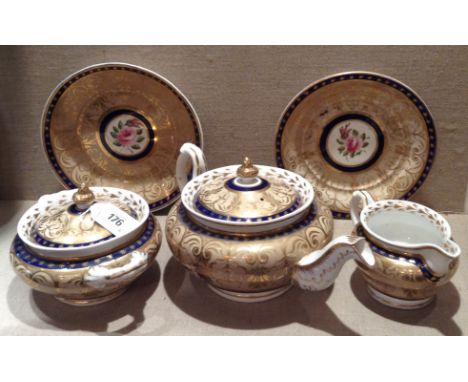 A COLLECTION OF EARLY 19TH CENTURY NEWHALL PORCELAIN  To include a teapot, decorated with narrow blue bands, over gilt with l