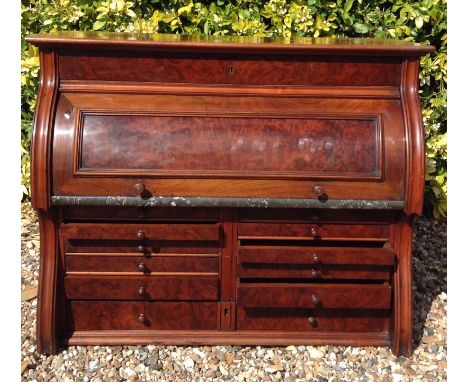 THE DENTAL MANUFACTURING COMPANY, MANCHESTER, AN EARLY 20TH CENTURY WALNUT CYLINDER TABLE TOP CABINET  Fitted with nine gradu