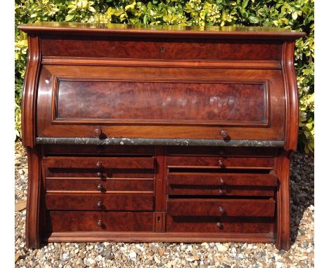 THE DENTAL MANUFACTURING COMPANY, MANCHESTER, AN EARLY 20TH CENTURY WALNUT CYLINDER TABLE TOP CABINET  Fitted with nine gradu