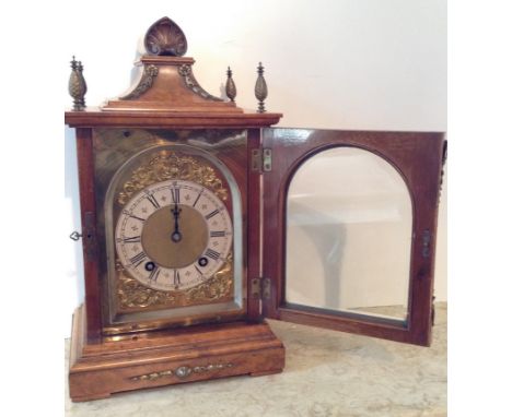 A 19TH CENTURY LENZKIRCH, GERMANY, WALNUT CASED MANTLE CLOCK With shell carved surmount above a tapered plinth between balust