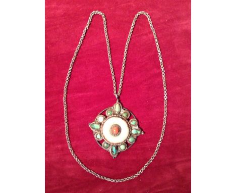 AN ORIENTAL SILVER, JADE AND CORAL MOUNTED PENDANT  Hung on a white metal chain. 