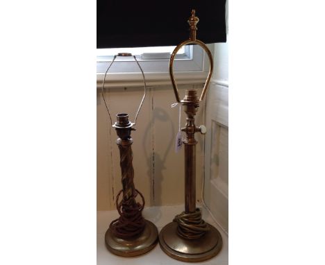 TWO EARLY 20TH CENTURY HEAVY BRASS CANDLESTICK LAMPS One with movable pivot (electrified).