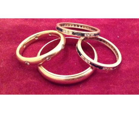 A COLLECTION OF 20TH CENTURY WEDDING RINGS  To include two multi diamond and sapphire rings, unmarked, an 18ct gold wedding r