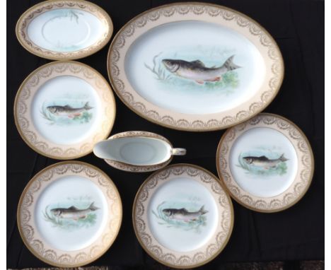A NORITAKE FISH SERVICE To include a large meat plate, four dinner plates, a gravy boat and two saucers, decorated with gilt 