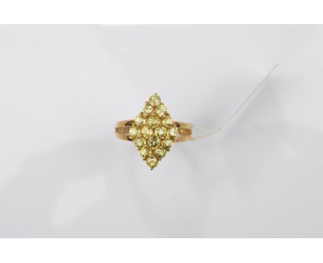 A certificated 9ct gold garnet dress ring, the round cut mali garnets in a navette shaped setting on bifurcated shoulders all