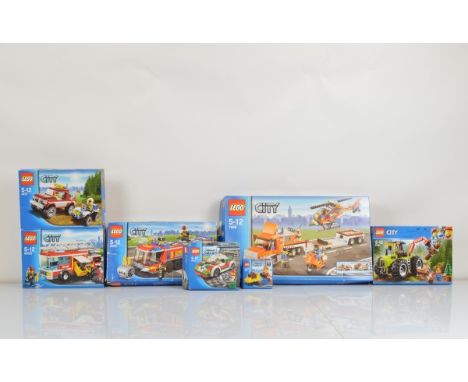 Seven boxed Lego City including Helicopter Transporter 7686 opened with manual and unchecked, Airport Fire Truck 60061 opened