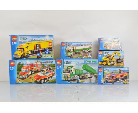 Seven boxed Lego City models, including Heavy Hauler 7998 opened and unchecked, City Truck 3221 opened with manual and unchec
