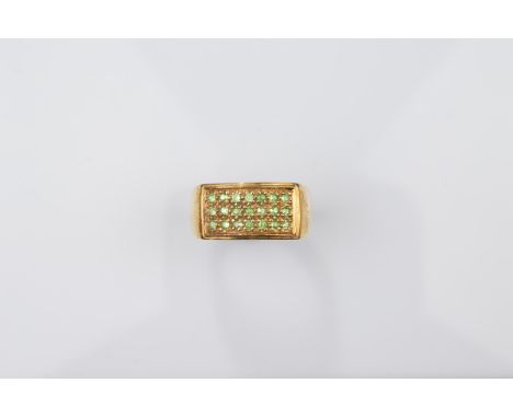 A certificated 9ct gold gentleman's tsavorite dress ring, the round cut green garnets in a rectangular tablet setting all in 