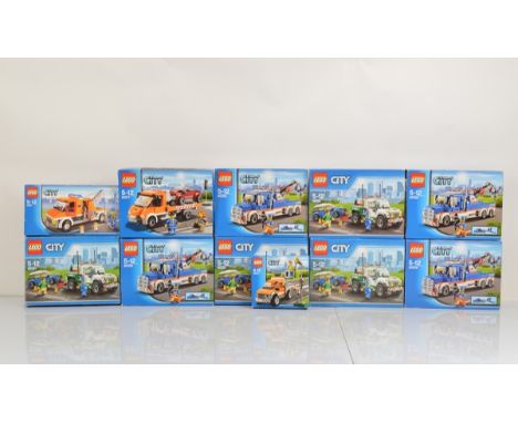 Eleven boxed Lego City models, including 4 x Tow Truck 60056 all opened with manuals and unchecked, 1 x Pickup Tow Truck 6008