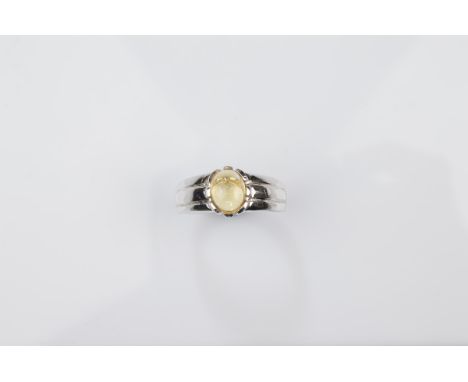 A certificated 9ct gold gentleman's gem set signet ring, white gold setting and shank surmounted with a cabochon citrine, rin