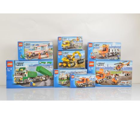 Eight boxed Lego City models, including Heavy Hauler 7998 opened with manual and unchecked, Helicopter Transporter 7686 opene
