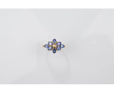 A certificated 18ct gold Ceylon sapphire and diamond dress ring, the flower setting with central brilliant cut diamond with o