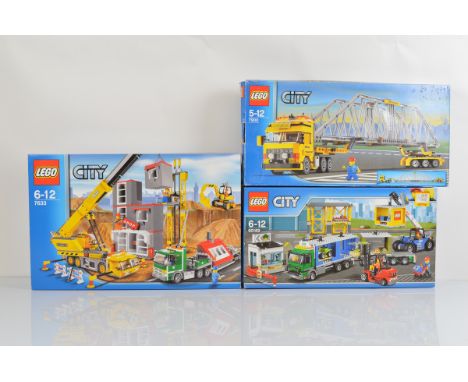 Three boxed Lego City models, Construction Site 7633, unopened, Cargo Terminal 60169, unopened and Heavy Loader 7900, opened 