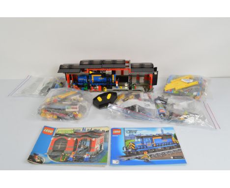 A collection of unboxed and unchecked Lego City, Cargo Train 60052 with manual and Train Engine Shed 10027 with manual 