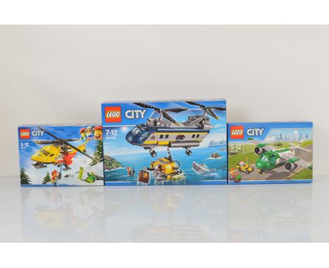 Three boxed Lego City models, including Deep Sea Helicopter 60093 unopened, Ambulance Helicopter 60179 unopened and Airport C