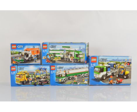 Five boxed Lego City models, including Auto Transporter 60060 unopened, Garbage Truck 60118 opened with manual and unchecked,
