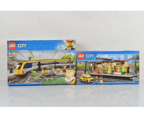 Two boxed Lego City models, including Train Station 60050 opened with manual, unchecked and Passenger Train 60197 unopened (2