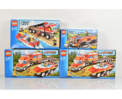 Four boxed Lego City models, including two x City Fire Transporter 4430 opened with manuals and unchecked, Off Road Fire Truc
