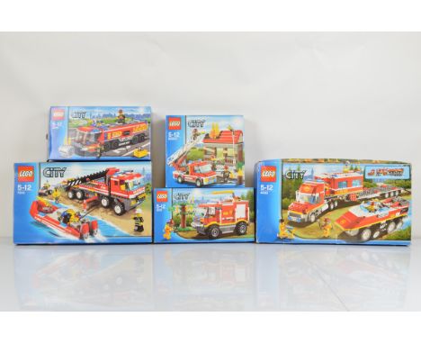 Five boxed Lego City models, including Fire Truck 4208 with manual, Fire Emergency 60003 with manual, Airport Fire Truck 6006