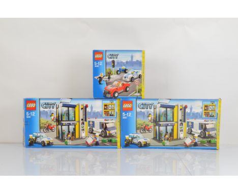 Three boxed Lego City models, including 2 x Bank and Money Transfer 3661 opened with manuals and unchecked and Police Chase 3