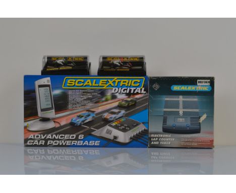Scalextric accessories,, including two perspex cased motorcycles af, an electronic lap counter and timer and a Scalextric dig