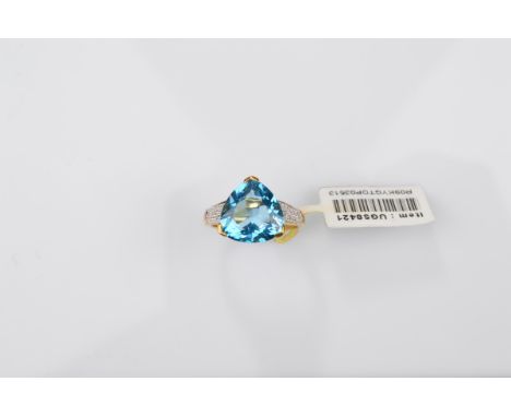 A certificated 9ct gold Swiss blue topaz and diamond dress ring, the trilliant claw set blue topaz with eight cut illusion se