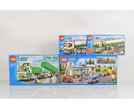 Four boxed Lego City models, including Service Station 60132 unopened, Classic Truck 7998 opened with manual and unchecked, T