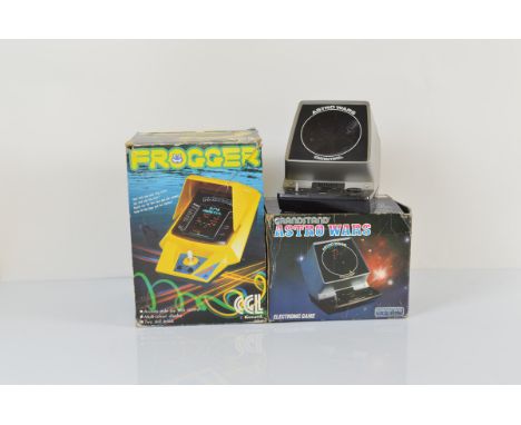 A Frogger by KJONAMI mini arcade game, with original box, console af, together with two Grandstand Astro Wars, one boxed with