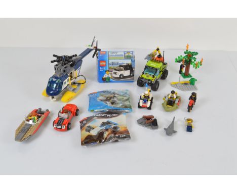 A collection of unboxed and unchecked Lego City, including Volcano Exploration Truck 60121 with manual, Helicopter Pursuit 60