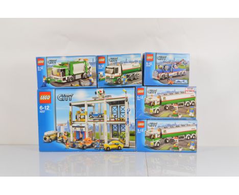 Six boxed Lego City models, including City Garage 4207 opened with manual and unchecked, Tank Truck 3180 opened with manual a