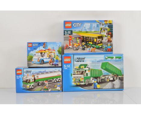 Four boxed Lego City models, including Classic Truck 7998 opened with manual and unchecked, Bus Station 60154 unopened, Ice C