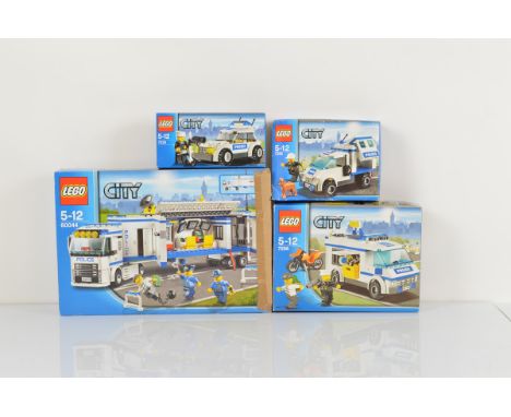 Four boxed Lego City models, including Prisoner Transport 7286 opened with manual and unchecked, Mobile Police Unit 60044 ope