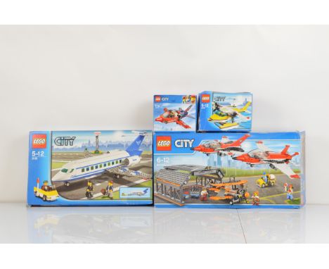 Four boxed Lego City models, including Airport Air Show 60103 opened with manual, unchecked, Passenger Plane 3181 opened with
