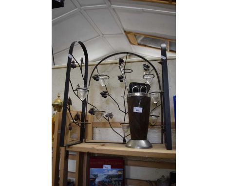 Folding metal T light holder together with fire tools