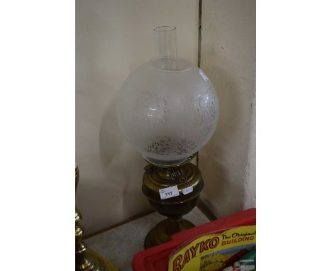 Brass based oil lamp with frosted glass shade