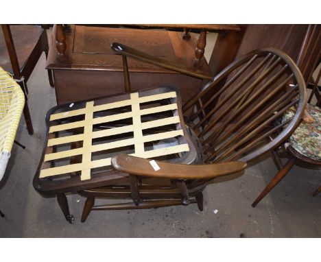 An Ercol chair frame and accompanying footstool