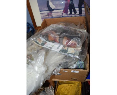 A quantity of various tapestry supplies