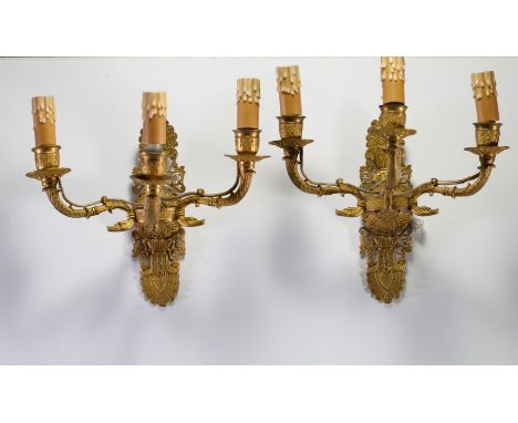 Pair of Empire ormolu sconces with three light points. Normal wear - Weight: 2.70 kg - Shipping unavailable - Region: France 