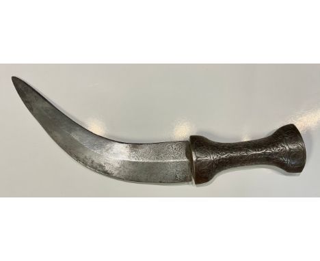 An Islamic dagger, steel grip and curved blade, chased in the Islamic taste,  26cm long 
