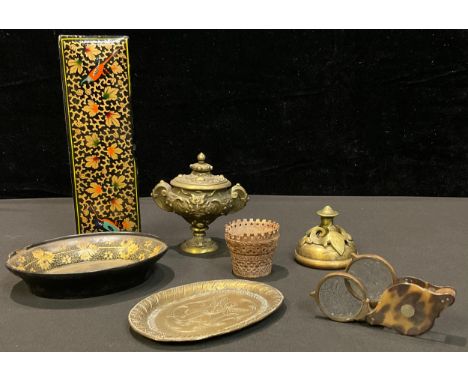 A papier-mâché miniature oval tray; a coquilla nut basket; a brass inkwell, a brass desk bell, a Persian style hand made smal