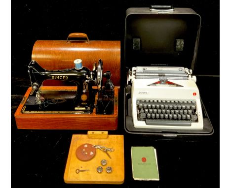 A Singer manual sewing machine in domed carry case, with key; a portable typewriter (2) 