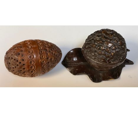 A Black Forest walnut inkwell; a coquilla egg pomander (2) 